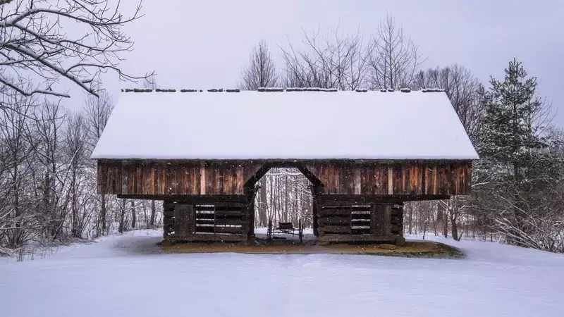cantilever barn in Cades Cove covered in snow