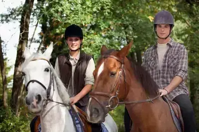 A young couple enjoying Cades Cove horseback riding.